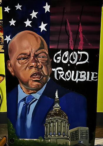 $2500 USD - "Uncle J: 'Good Trouble'" Painting By MoE at Iron Palm Tattoos. Marlon painted this inspiration as a tribute to the late senator John Lewis. Senator Lewis was instrumental in bringing about change during the civil rights movement. One of Dr King's proteges he went on to serve his people, state, and country until he passed away in office.. This piece is $2500.00 and can be purchased online only on IronPalmTattoos.com.