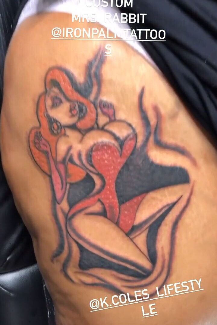 Jessica Rabbit From "Who Framed Roger Rabbit" Cartoon Movie Tattoo By Binky Warbucks. Jessica Rabbit tattoos often depict the iconic character from the film "Who Framed Roger Rabbit." These tattoos showcase Jessica's sultry and glamorous persona, emphasizing her curvaceous figure and red hair. Art enthusiasts choose this design for its nostalgic 1940s and 1950s appeal.