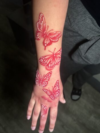 Redwork Butterfly Insect Tattoo By Lyric TheArtist. We like how Lyric used the white ink to accent the butterfly design. Lyric is a senior resident tattoo artist at Iron Palm Tattoos. Call 404-973-7828 or stop by for a free consultation.