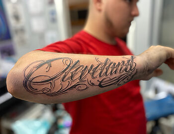 "Cleveland" Blackwork Lettering Tattoo By Majesty at Iron Palm Tattoos. Majesty is a new resident artist at Iron Palm and comes to us from Cleveland, Ohio. Iron Palm is Atlanta's only late night tattoo shop. Call 404-973-7828 or stop by for a free consultation.