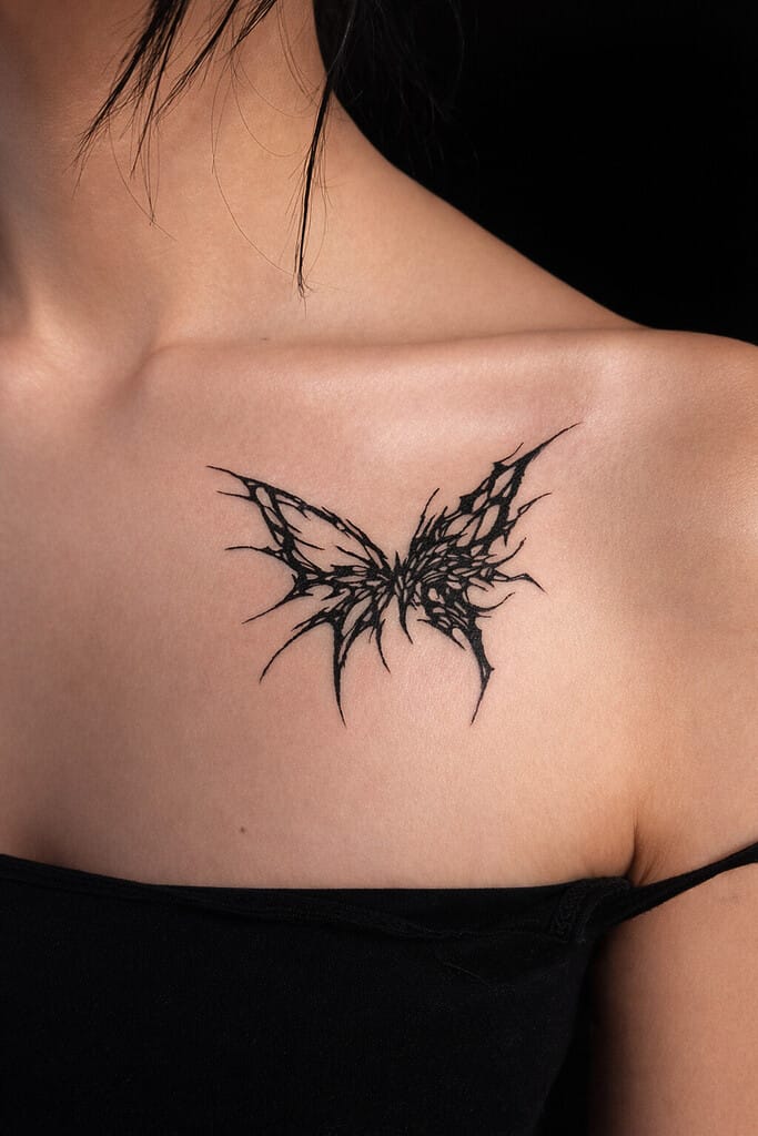 blackwork cybersigilism butterfly tattoo on upper chest