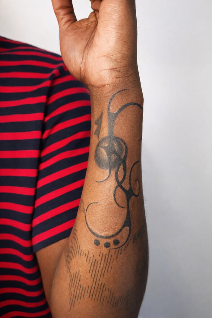 blackwork ornamental abstract forearm tattoo flowing design